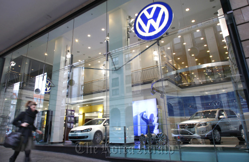 A pedestrian passes a Volkswagen dealership in Berlin, Germany. (Bloomberg)