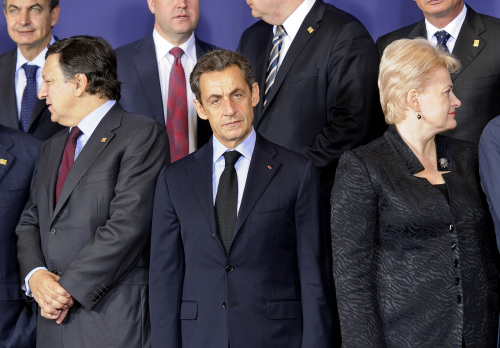 Left to right, front row, Jose Manuel Barroso, president of the European Commission, Nicolas Sarkozy, France's president, and Dalia Grybauskaite, Lithuania's president, pose for the family photograph of European Union leader's during the emergency summit at the European Council headquarters in Brussels, Belgium, on Sunday, Oct. 23, 2011.(Bloomberg)