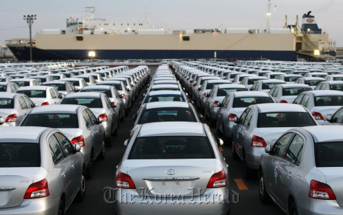 Toyota Motor Corp. Yaris compact vehicles bound for export sit in a lot at the port of Sendai, Japan. (Bloomberg)