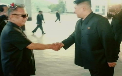 In video footage released Monday by North Korea’s official Korean Central TV Broadcasting Station, its authoritarian leader Kim Jong-il (left) shakes hands with his third son and heir apparent Kim Jong-un like equals after returning from his visit to Russia in August.