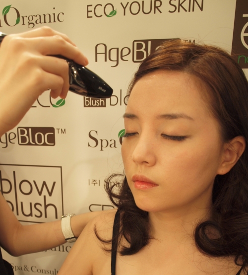A woman receives airbrush makeup service at blowblush. (blowblush)