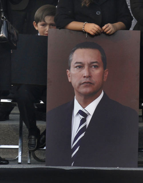 Son of Mexico’s Interior Minister Francisco Blake Mora, mourns his father during funeral in Mexico City on Saturday. (AP-Yonhap News)