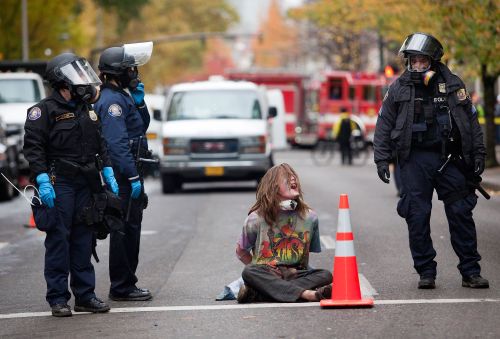 A protester shouts in handcuffs in Portland, Oregon on Sunday. (AFP-Yonhap News)