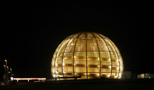 The globe of the European Organization for Nuclear Research, CERN, is illuminated outside Geneva, Switzerland. (AP-Yonhap News)