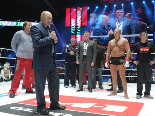 Russian Prime Minister Vladimir Putin, 2nd left, congratulates Russian heavyweight mixed martial arts fighter Fedor Emelianenko, 2nd right, after his victory over American Jeff Monson, in Moscow, Sunday, Nov. 20, 2011. (AP)