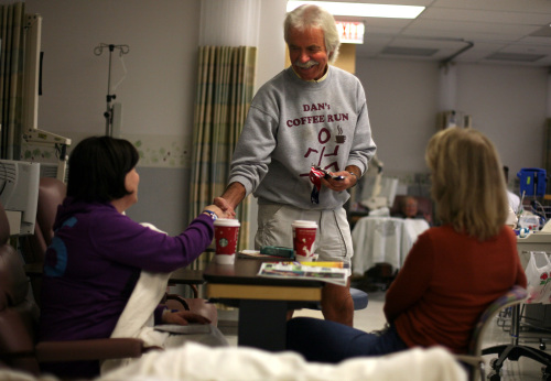 Dan Dewey (center) of Dan`s Coffee Run, hands out coffee to Mechelle Burdette (left) cancer patient from East Pointe and her aunt Sharon Ralston, of Palmcoast, Florida, while at the Michigan Cancer Institute in St. Joseph Mercy Oakland Hospital in Pontiac, Michigan, Nov. 3. (Andre J. Jackson/Detroit Free Press/MCT)