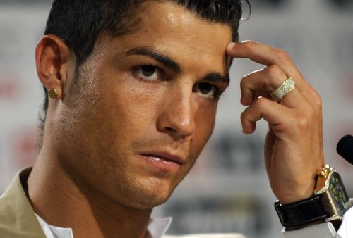 A file photo taken on July 6, 2009 shows Real Madrid`s Portuguese player Cristiano Ronaldo gesturing while giving a press conference after his official presentation at the Santiago Bernabeu stadium in Madrid. (AFP)