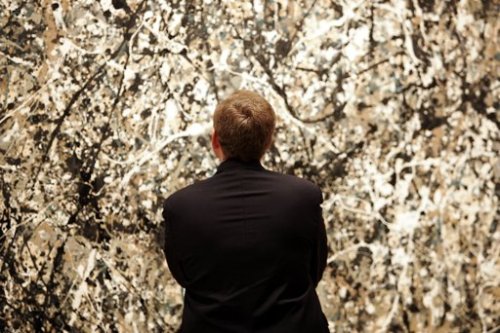 A man views a painting by Jackson Pollock at the Museum of Modern Art in New York. (AFP)