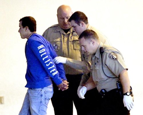 Murder suspect Ryan Brunn, 20, of Canton, Ga., is escorted into the Cherokee County jail in Canton, Ga., after he was arrested Wednesday,Dec. 7, 2011. (AP)