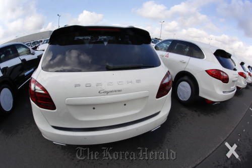 Porsche SA Cayenne automobiles sit waiting for delivery at the company’s factory in Leipzig, Germany. (Bloomberg)