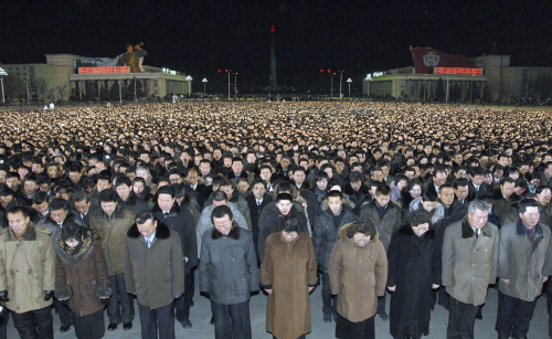 North Koreans pay respects to their late leader Kim Jong-il at Kim Il-sung Square in Pyongyang, North Korea. (AP-Yonhap News)