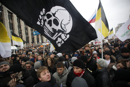 Demonstrators participate in a rally protesting election fraud in Moscow on Saturday. (AP-Yonhap News)