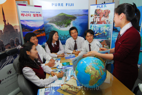 Hanatour workers attend a brainstorming session on new travel products.