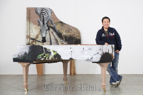 Artist Kim Nam-pyo poses with his work “Instant Landscape” at the exhibition “Art Forte.” (Gana Art Center)