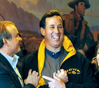 Republican presidential candidate Rick Santorum arrives to meet supporters in Boone,Iowa, Monday. (UPI-Yonhap News)