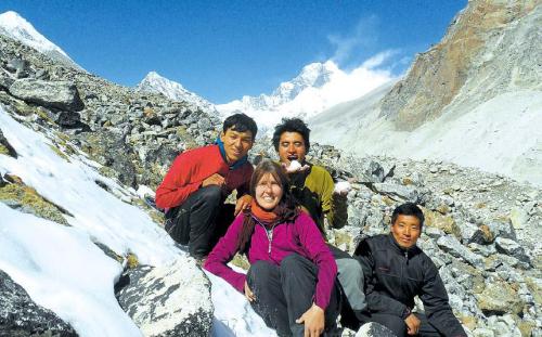 Trekker Susanne Stein (center), poses for a photograph with mountain guides during a Great Himalayan Trail hike in Nepal. In the shadow of Mount Everest and its magnetic lore, a cross-border route with a grand name, the Great Himalaya Trail, is being touted as an epic, untapped alternative to the bucket-list trek to base camp on the world‘s highest mountain. (AP-Yonhap News)