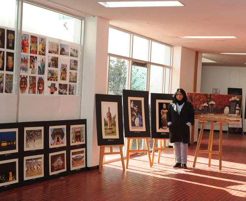 Sampa Guhamajumdar poses with her exhibition photos. (Sampa Guhamajumdar)