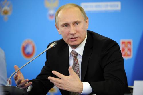 Russia's Prime Minister Vladimir Putin speaks while meeting FIFA president Sepp Blatter and his European counterpart Michel Platini in Saint-Petersburg, on January 19, 2012. Putin, Blatter and Platini joined today in the celebrations to mark the centenary of the Russian Football Union (RFU) in Saint Petersburg. (AFP)