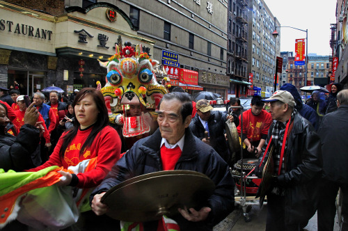 A procession featuring masqueraders in dragon costumes parade through the streets of Chinatown marking the start of the Lunar Year and the Year of the Dragon, on Monday, Jan. 23, 2012 in New York. (AP)