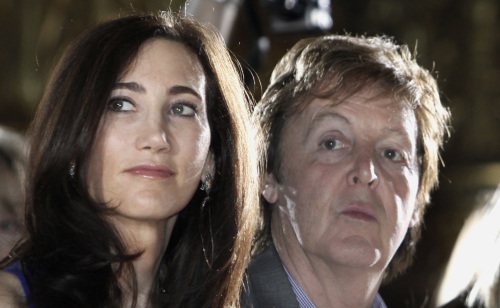 FILE- In this March 8, 2010 file photo, Paul McCartney and Nancy Shevell watch the presentation of British fashion designer Stella McCartney's fall-winter 2010-2011 ready-to-wear collection in Paris. Shevell, who married McCartney in October 2011, announced her resignation from the board of New York City?s Metropolitan Transportation Authority at its meeting on Wednesday, Jan. 25, 2011. (AP)