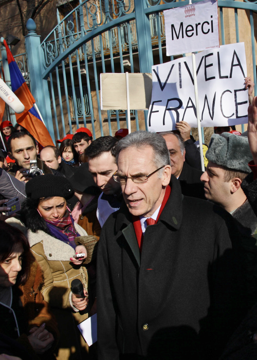 French Ambassador to Armenia Henry Renault speaks to activists of an Armenian youth group gathered at the French Embassy in Yerevan to express their gratitude to France’s parliament for passing a bill that outlaws denial of Armenian genocide, in Yerevan, Armenia, Tuesday. (AP-Yonhap News)