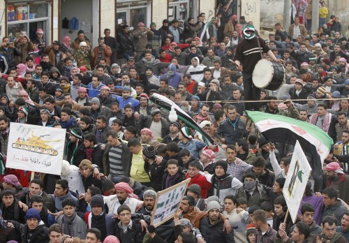 Anti-Syrian regime protesters hold a demonstration in Idlib, Syria, Monday. (AP-Yonhap News)