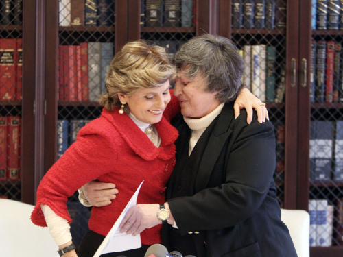 Robin Tyler (right) who with her partner Diane Olson, not shown, became the first same-sex couple to wed in Los Angeles County in 2008, embraces her attorney Gloria Allred after hearing an appeals courts decision on the validity of gay marriage, in Los Angeles, Tuesday. (AP)