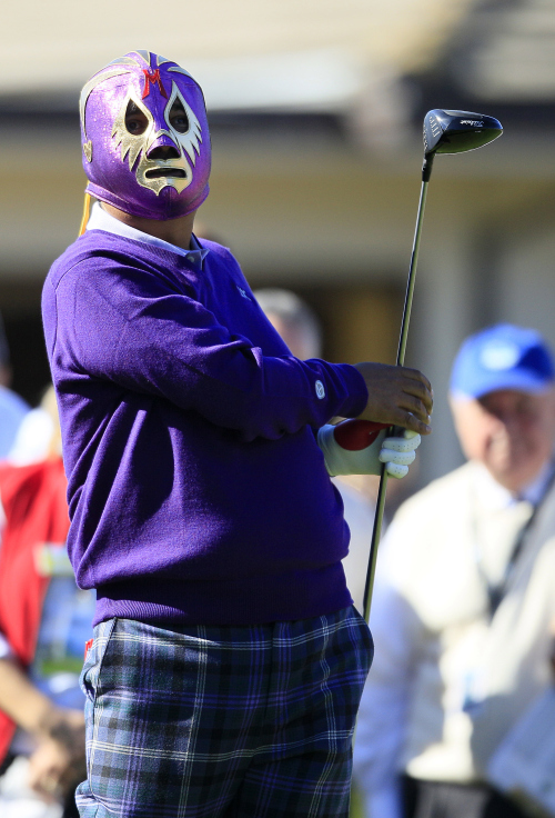 Actor George Lopez wears a wrestling mask as he tees off during the celebrity challenge at the AT&T Pebble Beach National Pro-Am golf tournament in Pebble Beach on Wednesday. (AP-Yonhap News)