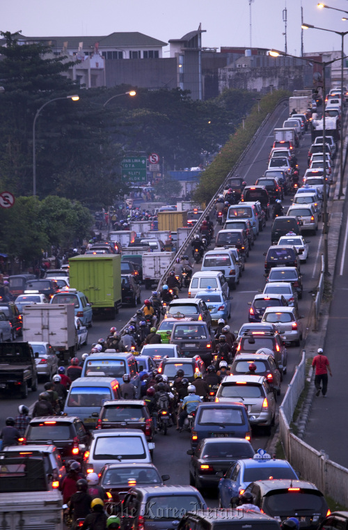 Indonesian drivers are caught in a traffic jam during rush hour in Jakarta. (Bloomberg)