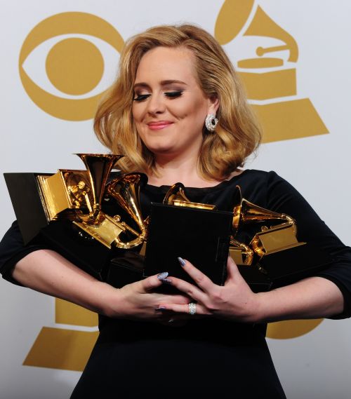 Musician Adele poses with her six trophies at the 54th Grammy Awards in Los Angeles, California on Sunday, Feb. 12. (AFP)