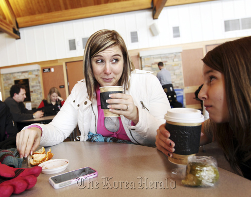 Jen Emmett, having hot chocolate with niece, Kenzie Wolff (right) in Maple Grove, Minnesota, finds the acronym PANK (Professional Aunt, No Kids) applies to her. (Minneapolis Star Tribune/MCT)