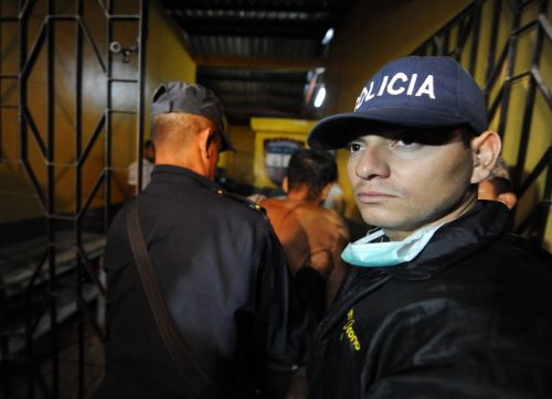 A surviving inmate is escorted out of the compound at the National Prison of Comayagua where at least 200 prisioners were killed and scores injured when fire tore through the prison in central Honduras, the Central American country`s prisons director said. The prison held around 850 prisoners. (AFP-Yonhap News)