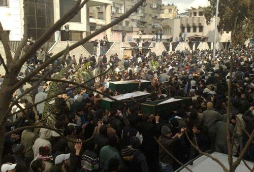 Syrian mourners carrying the coffins of demonstrators who activists said were killed by regime forces during a mass funeral in the Mazzeh district in Damascus. Security forces shot dead a mourner at the funeral for demonstrators killed in rare protests in the Syrian capital after a senior Chinese envoy issued a plea for the bloodshed to end. (AFP-Yonhap News)