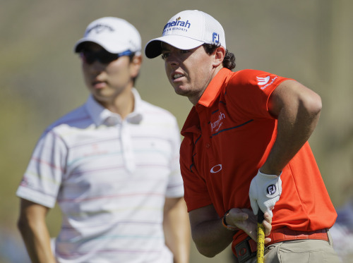 Rory McIlroy (right) and Bae Sang-moon on the second hole (AP-Yonhap News)