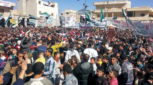 Demonstrators take part in protests against Syrian President Bashar al-Assad after Friday prayers in Binsh near Idlib in Syria. (UPI-Yonhap News)