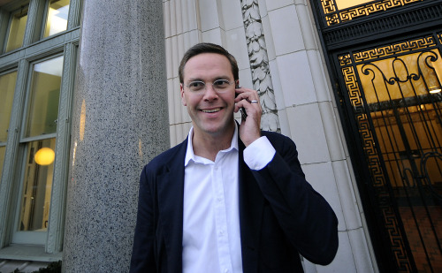 James Murdoch, deputy chief operating officer of News Corp., talks on the phone in New York on Tuesday. (Bloomberg)