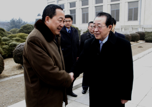 North Korea's First Vice Foreign Minister Kim Kye Gwan, right, shakes hands with Ri Yong Ho, a Vice Minister of North Korea's Ministry of Foreign Affairs, at Pyongyang airport in North Korea, Tuesday, Feb. 21, 2012. Kim, North Korea's top nuclear envoy, left Pyongyang for Beijing ahead of important nuclear talks with the United States later this week. (AP)