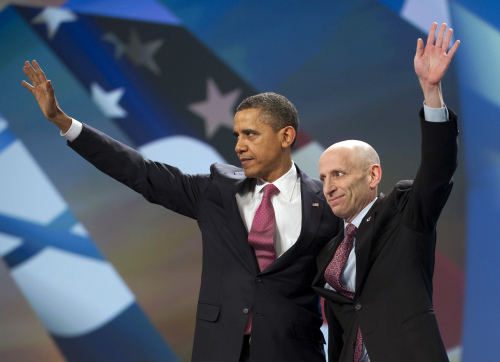 U.S. President Barack Obama and American Israel Public Affairs Committee President Lee Rosenberg wave to AIPAC delegates assembled during a policy conference in Washington, D.C. on Sunday. (Bloomberg)