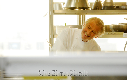 Three-star Michelin chef Pierre Gagnaire poses in the kitchen of his eponymous restaurant at Lotte Hotel, Seoul, on Feb. 29. Ahn Hoon/The Korea Herald