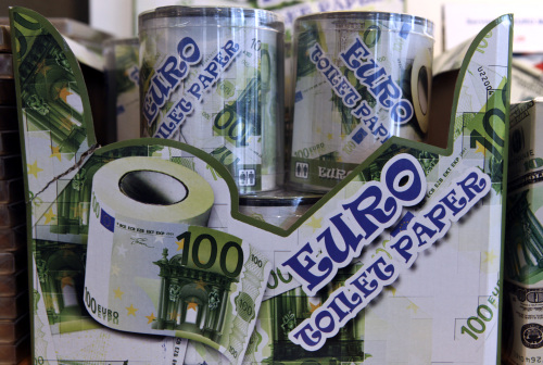 Tins of toilet tissue, printed in the style of a 100 euro note, sit for sale in a souvenir store in Frankfurt. (Bloomberg)