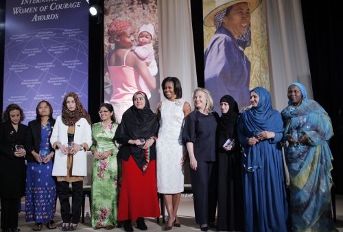 Secretary of State Hillary Rodham Clinton and first lady Michelle Obama pose for a photo with the recepients of the 2012 International Women of Courage Award Thursday. (AP)