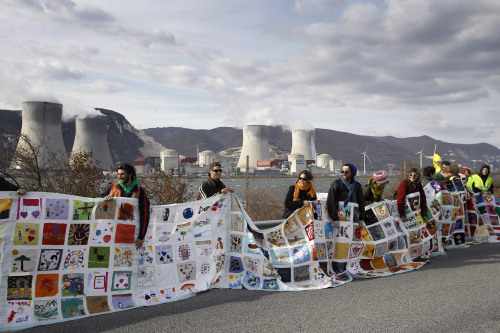 Anti-nuclear supporters demonstrate in front of the Cruas nuclear power plant in La Coucourde, south France, March 11, 2012. (AP)