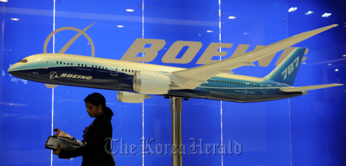 A model of a Boeing Co. 787 Dreamliner stands on display at the Singapore Airshow in Singapore. (Bloomberg)