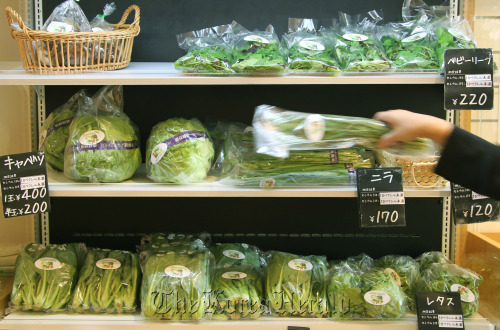 Vegetables grown in Fukushima Prefecture that have been checked for radiation are displayed for sale at a Cataloghouse Ltd. store in Tokyo. (Bloomberg)