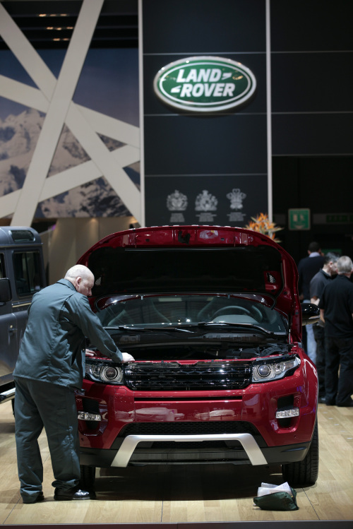 A man prepares a Range Rover Evoque, produced by Jaguar Land Rover Plc, at the Geneva International Motor Show in Geneva on March 5. (Bloomberg)