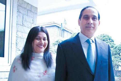 Ambassador Shaukat Ali Mukadam and his wife Kauser pose after thePakistani national flag was raised to mark their national day, on Friday at their Seoul residence. (Kirsty Taylor/The Korea Herald)