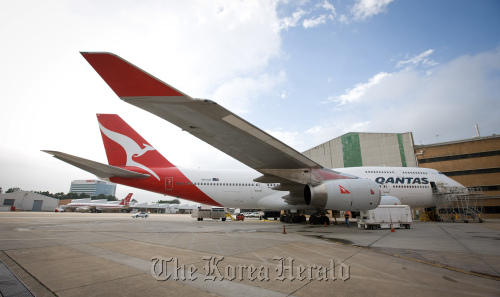 A Qantas Airways Ltd. Boeing Co. 747 aircraft stands in Sydney. (Bloomberg)