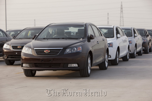 Geely Automobile Holdings Ltd. Emgrand 7 series automobiles are parked at the company’s factory in Cixi, Zhejiang Province, China. (Bloomberg)