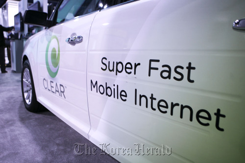 Signage for mobile internet provided by Clearwire Corp. sits on display at an electronics show. (Bloomberg)