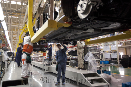 Employees work at Geely Automobile Holdings Ltd.’s factory in Cixi, Zhejiang Province, China. (Bloomberg)